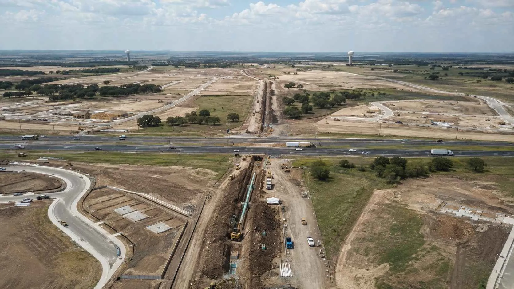 Multiple water towers serving adjacent US-380 corridor communities in Collin County.