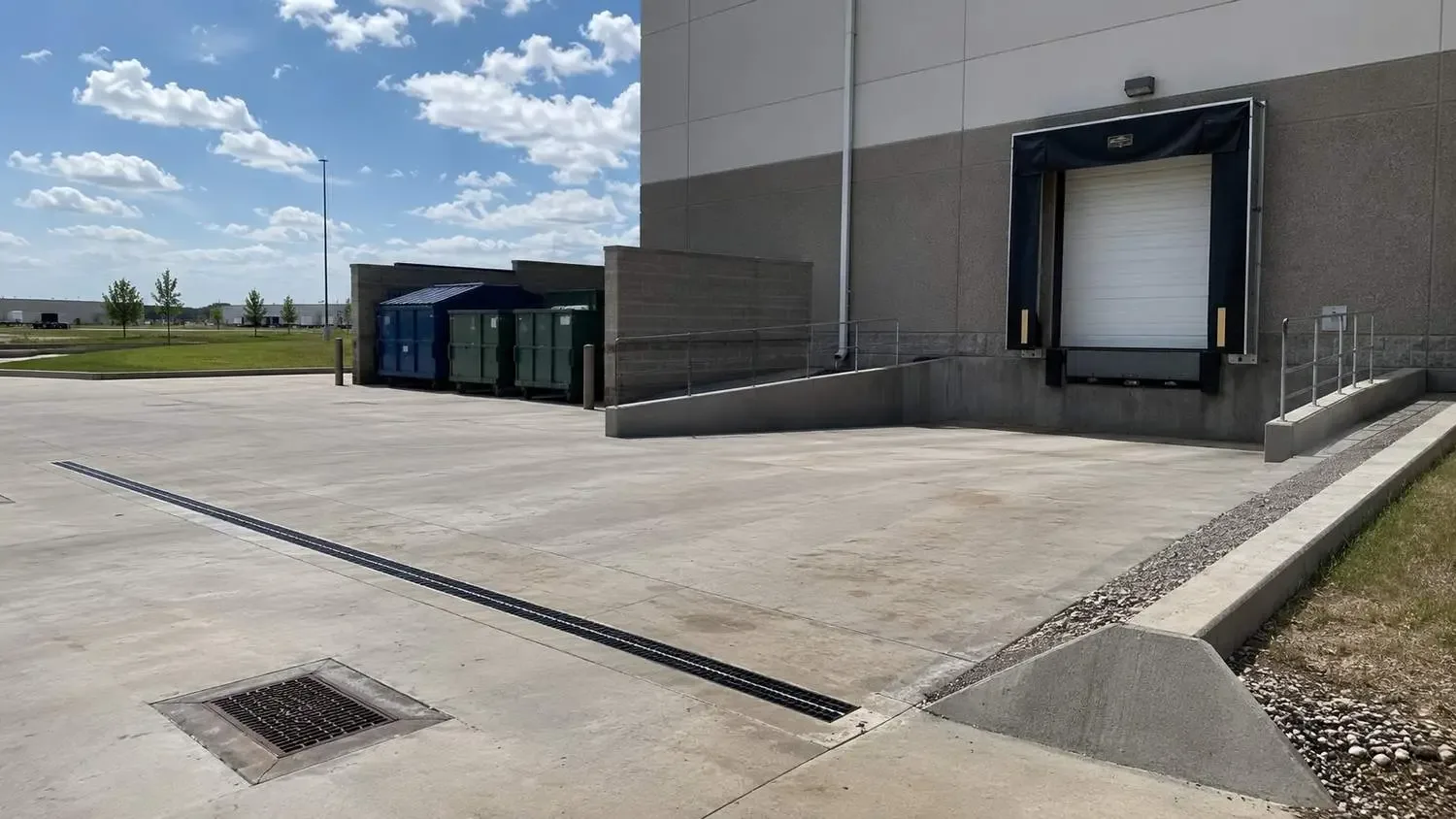 Outdoor loading dock and stormwater drainage at Dallas food manufacturing site.