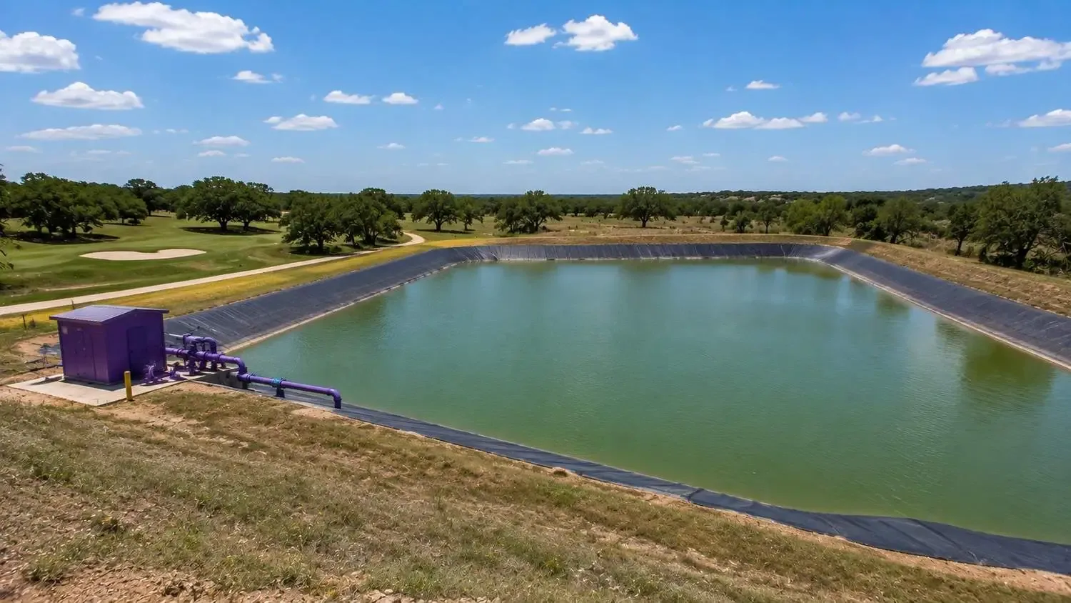Reclaimed water seasonal storage irrigation pond at Central Texas master planned community.