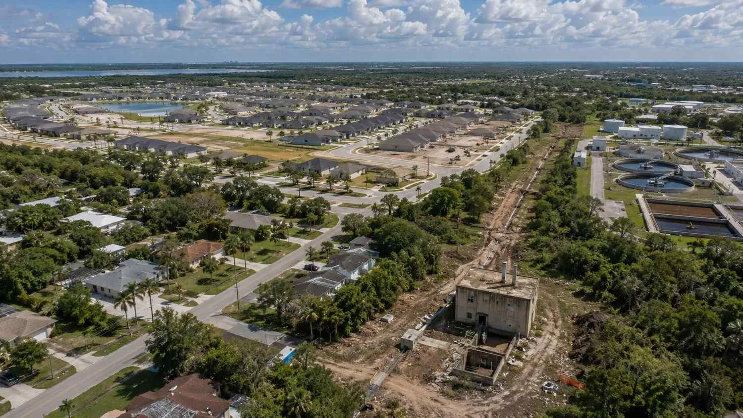 Aerial view of a Florida coastal community with aging wastewater infrastructure and rapid residential growth.