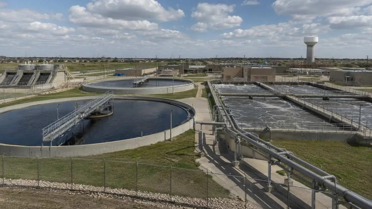 Municipal wastewater treatment plant receiving industrial discharge in Dallas area.